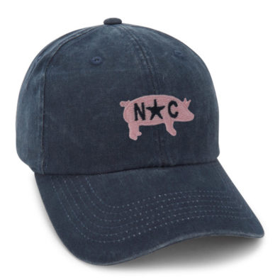 Imperial navy blue pigment washed cap with small pink pig and NC embroidered on top